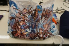 【TGS2015】メーカー無料配布物まとめ“ファンキル×まどマギ”コラボ設定資料冊子、ガルパン＆アルペジオ限定コミック、お米など 画像